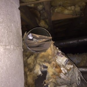 Disconnected Ductwork Under Home Stuffed With Cardboard